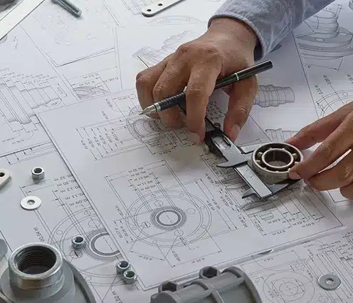 Mechanical engineering workspace with component measuring and antenna hardware CAD drawings
