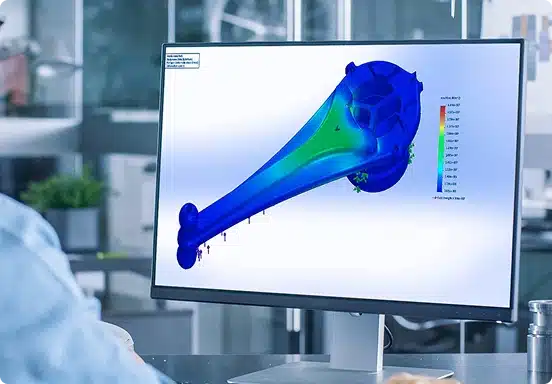 Engineer reviewing electromagnetic simulation results on workstation for antenna design analysis
